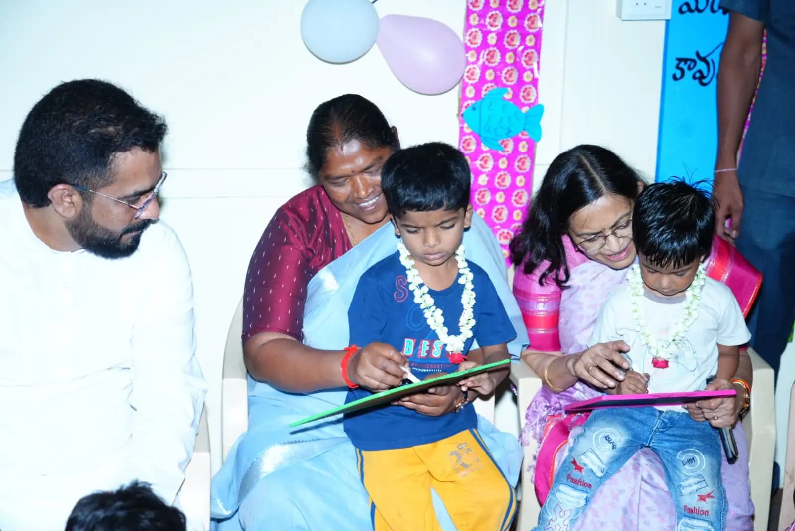చిన్నారులకు అక్షరాభ్యాసం చేయించిన మంత్రి సీత క్క